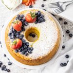 chiffon cake topped with powdered sugar, blueberries and strawberries