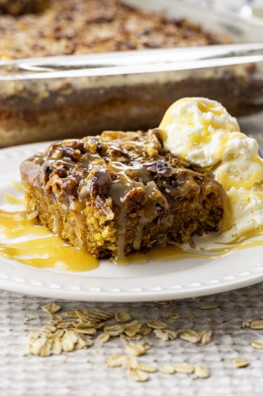 slice of oatmeal cake topped with pecans and coconut