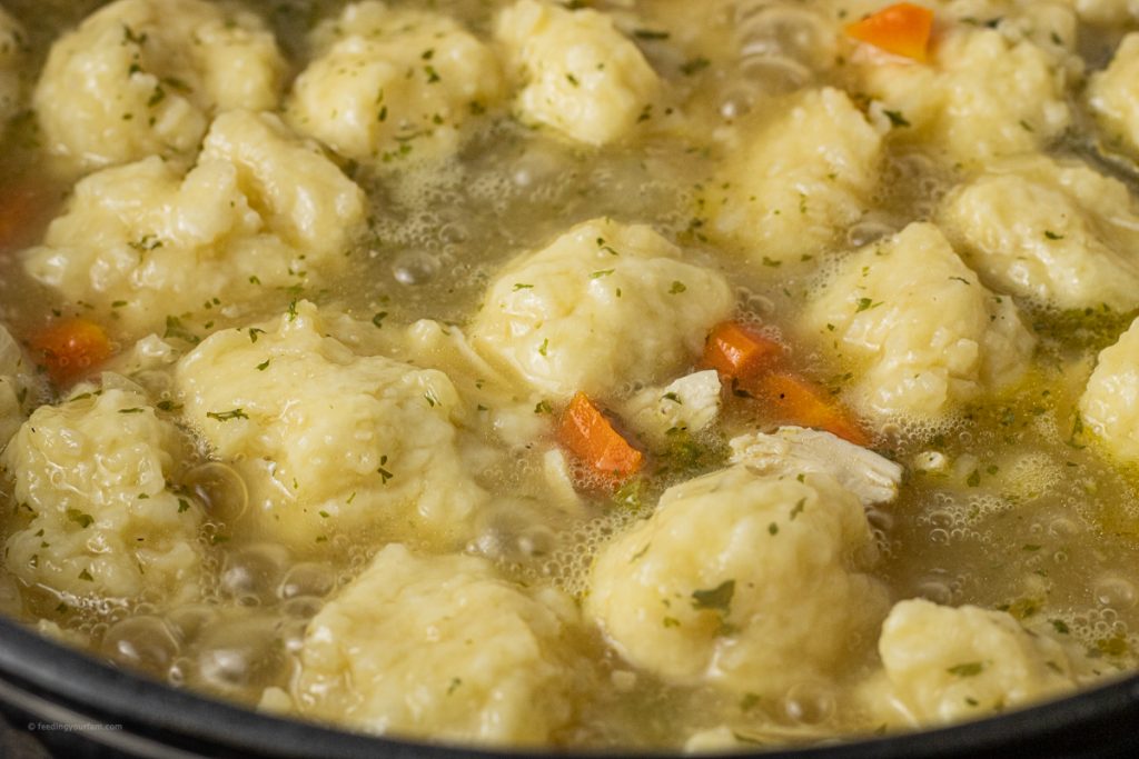 pot of floating dumplings in chicken soup