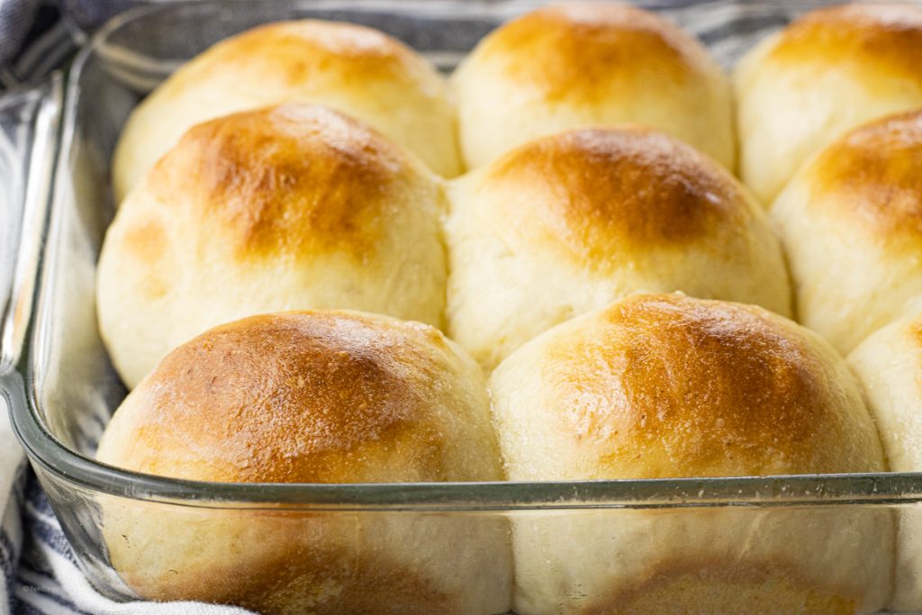 close up of golden brown, baked white rolls