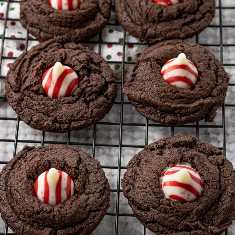 chocolate cookies topped with a red and white chocolate candy