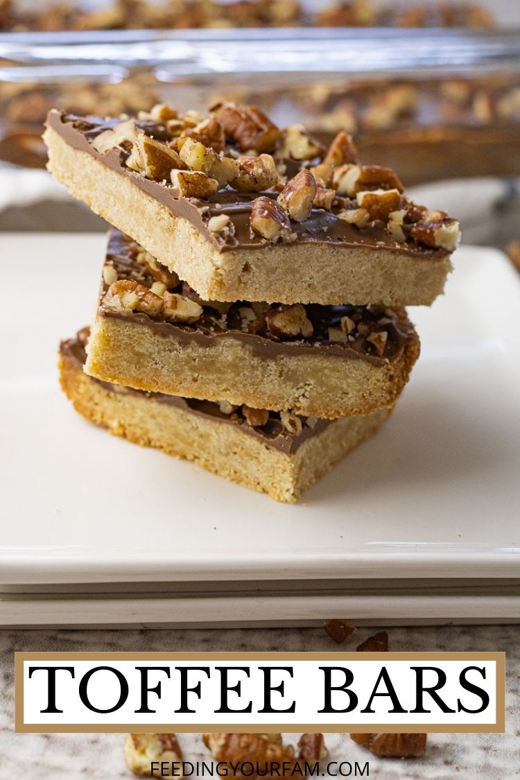 If you love the flavors of Homemade Toffee, then you will love the taste of this simple recipe for Toffee Bars. Toffee Bars have a delicious shortbread, crunchy crust topped with milk chocolate and chopped pecans. This recipe is super simple to make and makes a big batch, perfect for sharing or taking along to a potluck.