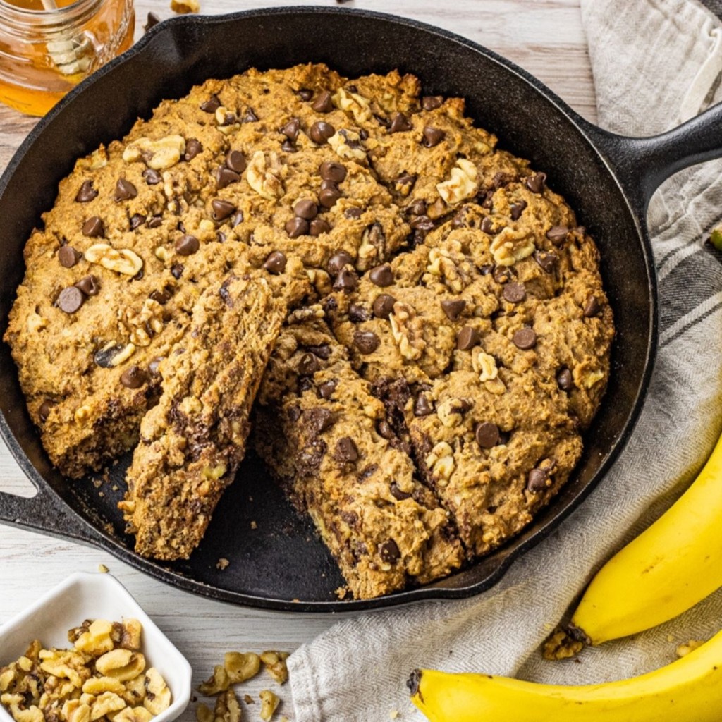 whole wheat banana bread with chocolate chips in a cast iron pan