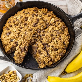 whole wheat banana bread with chocolate chips in a cast iron pan