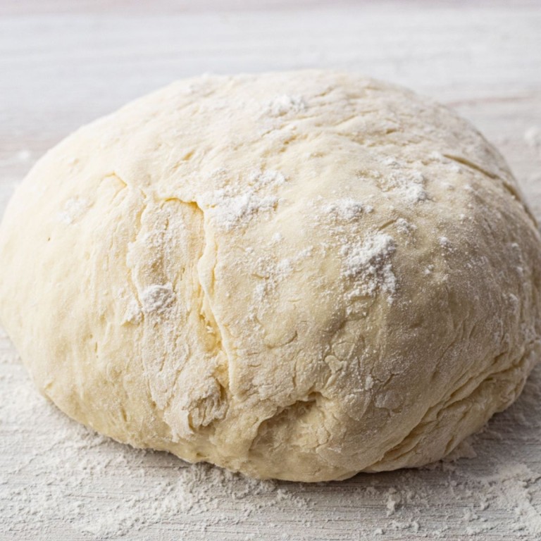 ball of dough dusted with flour