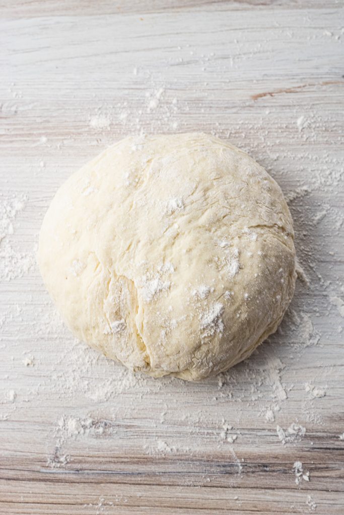 ball of dough dusted with flour