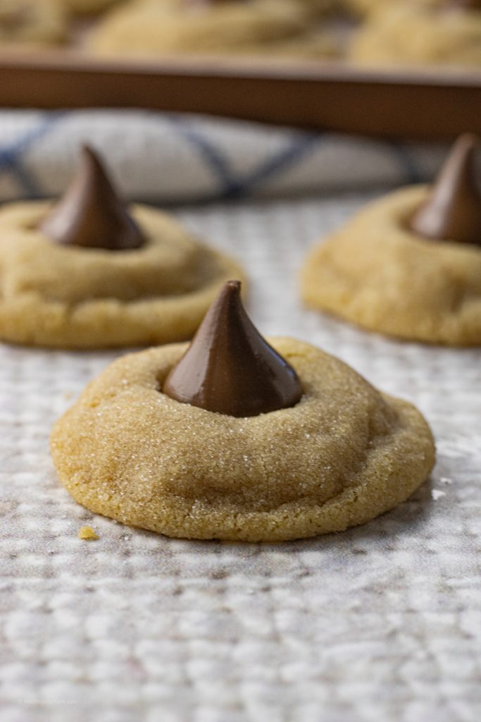 peanut butter cookies topped with a chocolate kiss candy