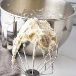 frosting on a whisk of a stand mixer
