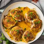 baked chicken thighs in a round baking dish