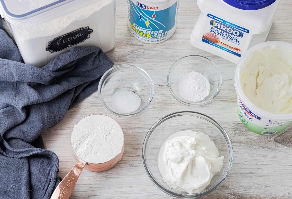 flour, baking soda, salt in greek yogurt in glass bowls