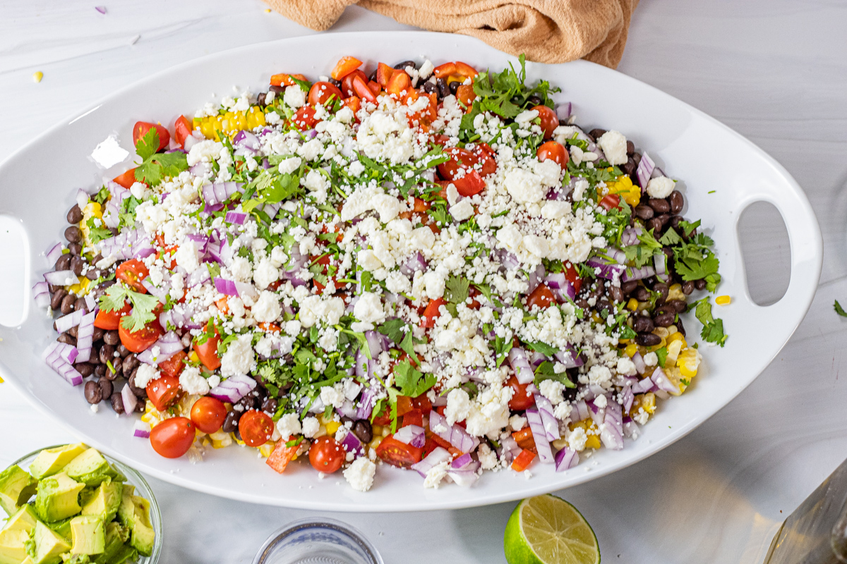 corn salad topped with feta cheese