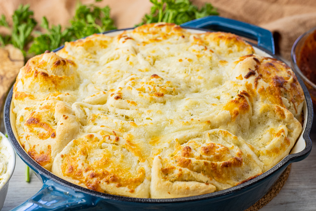pan filled with cheesy garlic rolls