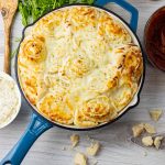 cheesy garlic rolls in a cast iron pan