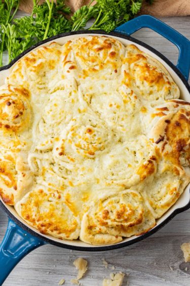 cheesy rolls in a cast iron pan