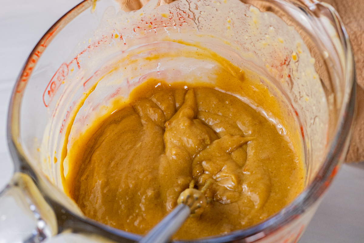sauce made with peanut butter in a glass measuring cup