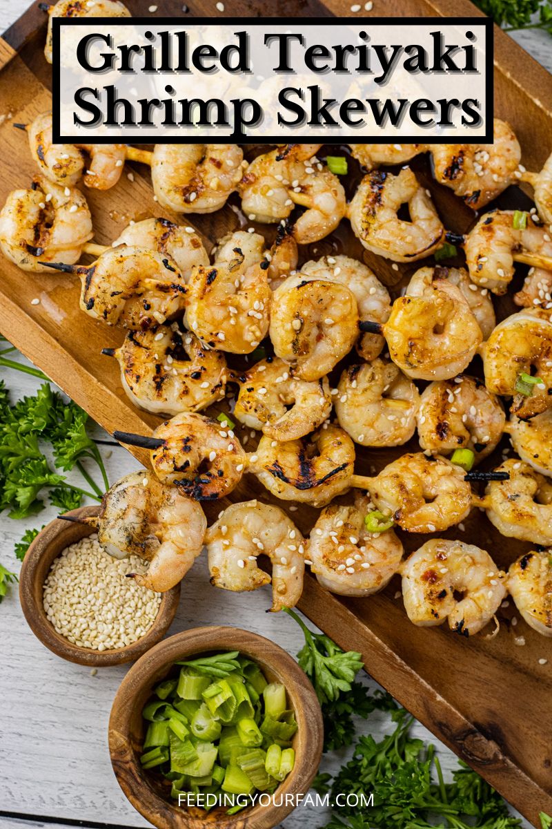 grilled shrimp skewers on a wooden platter