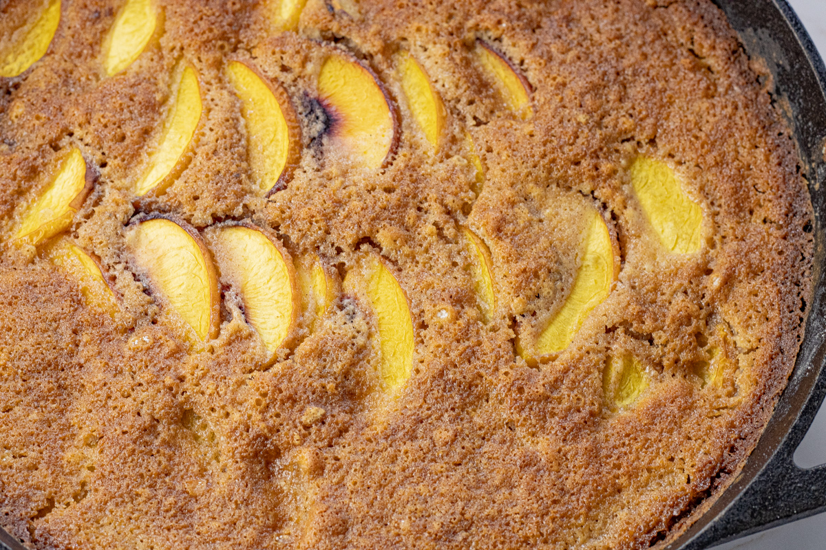 close up of baked peach cobbler