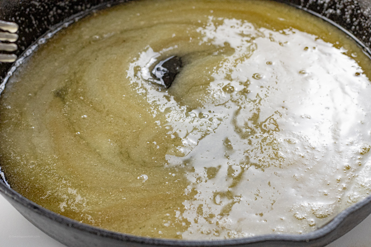 melted butter and sugar in a cast iron pan