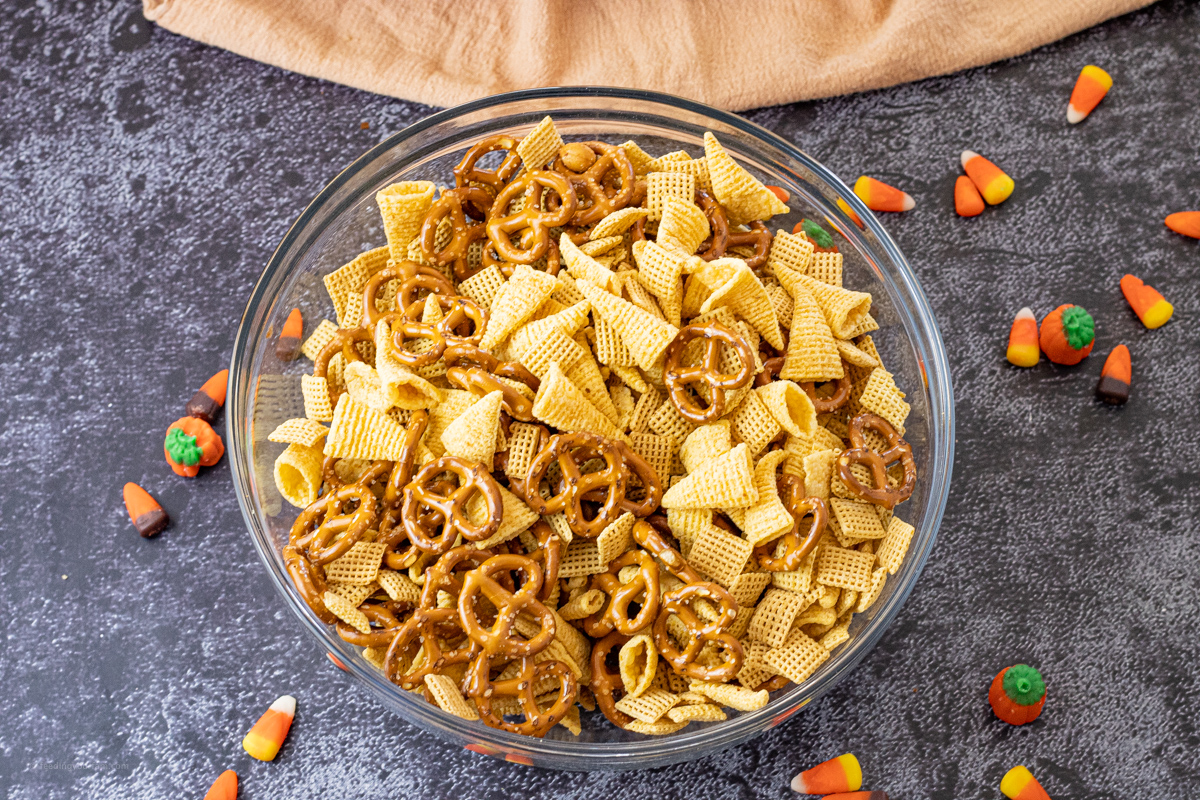 pretzels, Chex cereal and Bugles in a glass mixing bowl