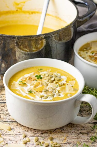 white bowl filled with butternut squash soup