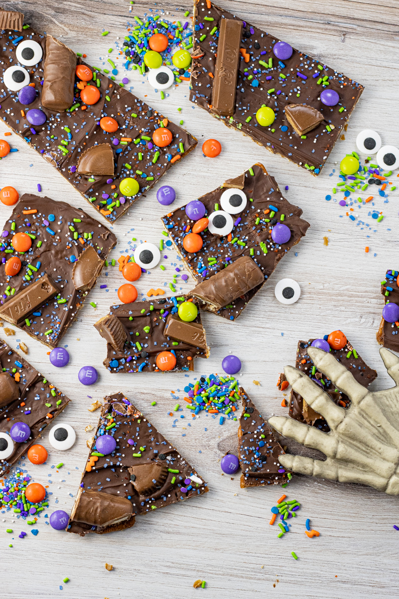 pretzel bark covered with chocolate, halloween sprinkles and candies