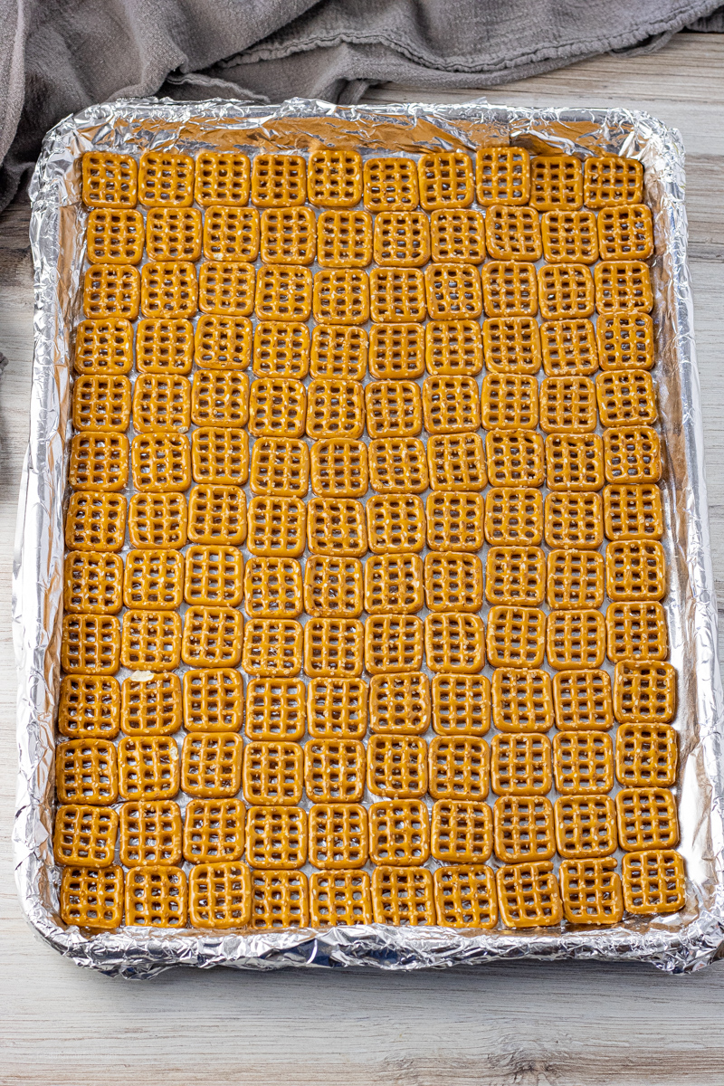 layer of pretzel snaps on a foil lined baking sheet