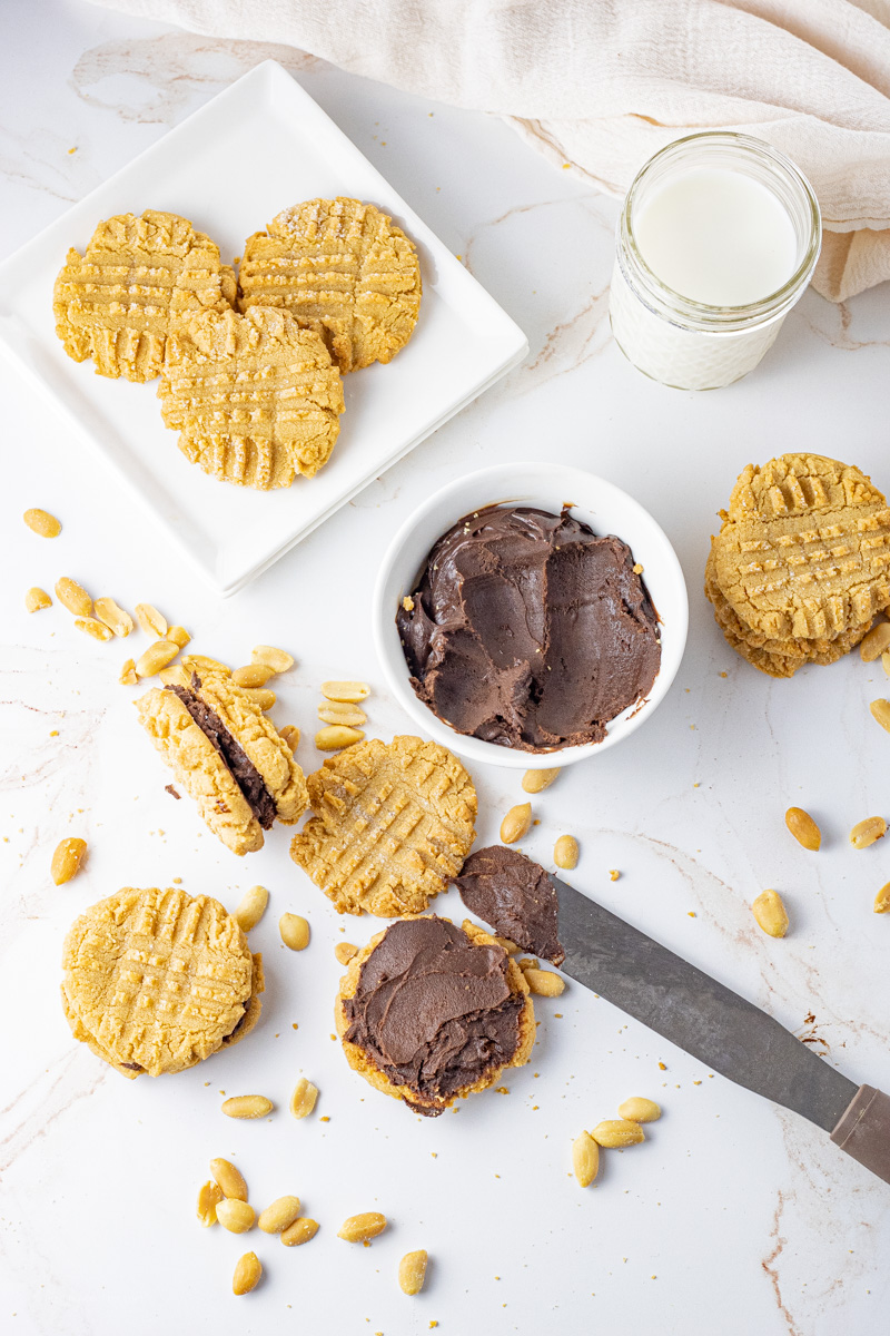 peanut butter cookies with chocolate spread in the middle