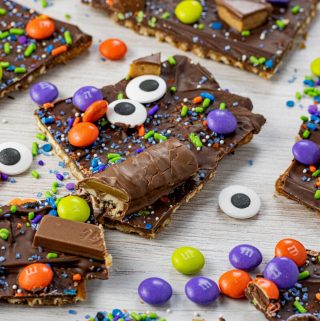 broken pieces of pretzel toffee topped with sprinkles and candy