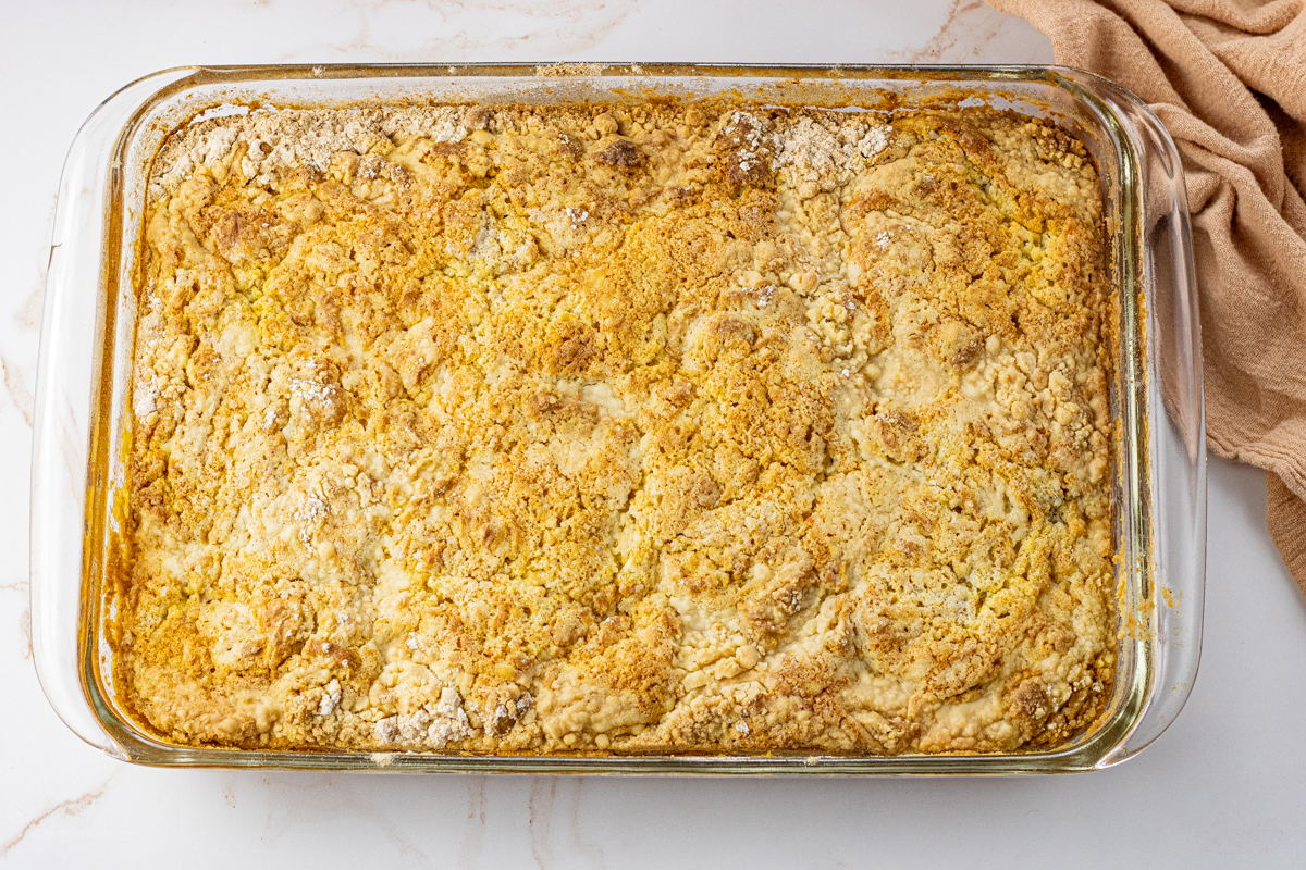 golden baked pumpkin cake in a glass baking dish