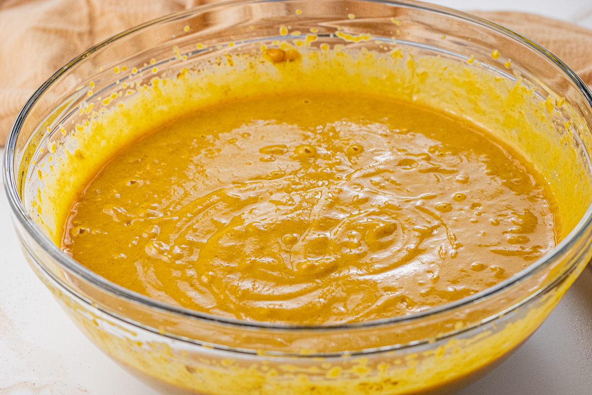 pumpkin pie mixture in a glass mixing bowl