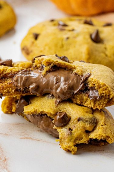 pumpkin chocolate chip cookies stuffed with melty chocolate