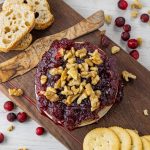 baked brie topped with cranberries and walnuts