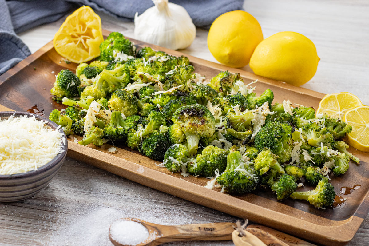 roasted broccoli on a wooden serving platter