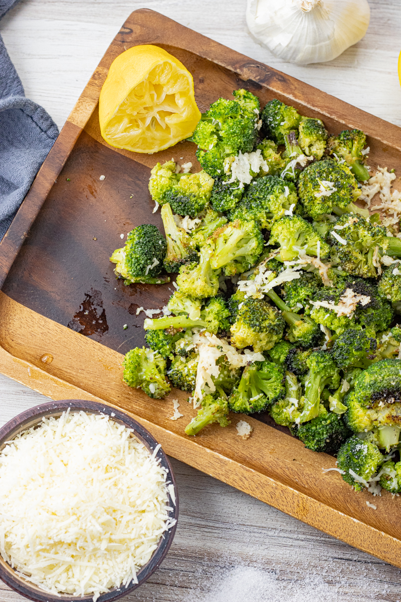 broccoli that has been roasted and topped with parmesan cheese