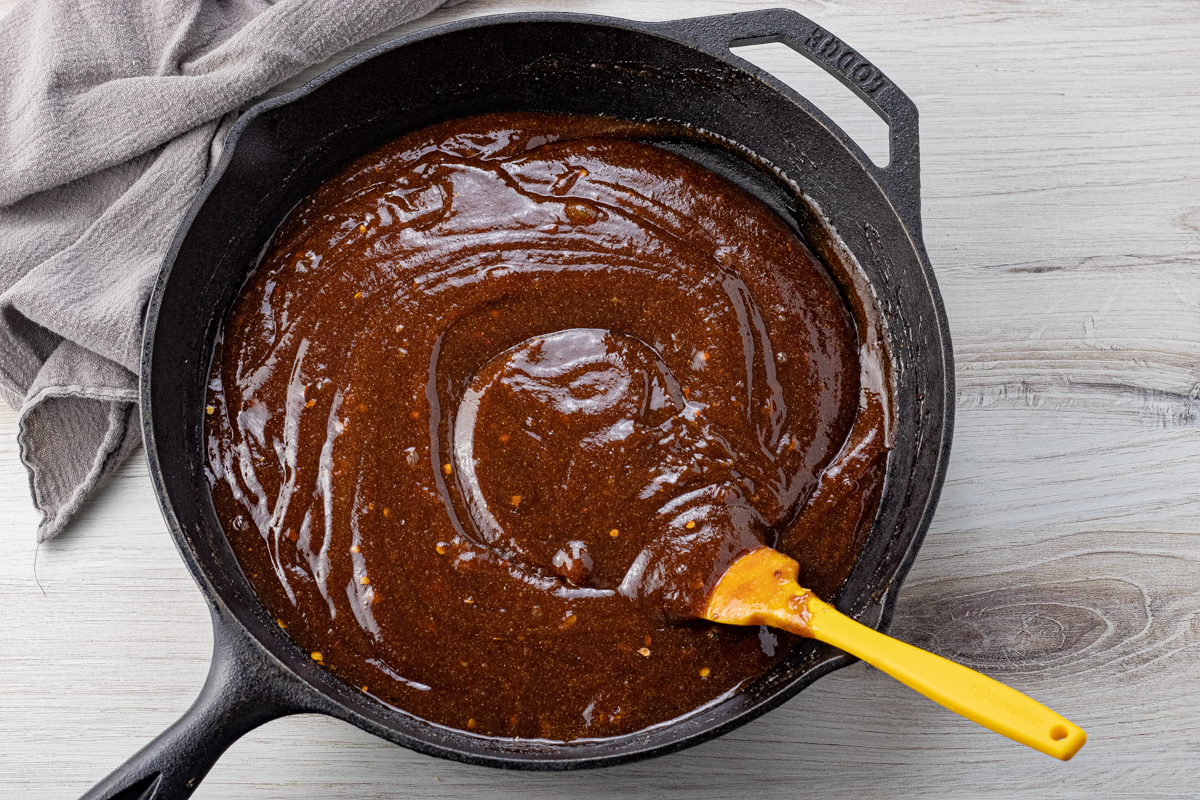 cast iron pan with barbecue sauce
