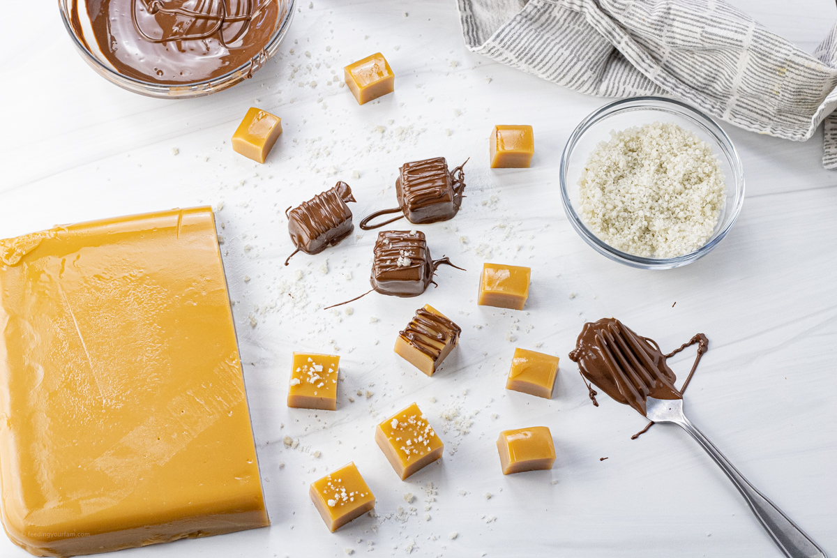 slab of caramel next to smaller squares of caramels around it