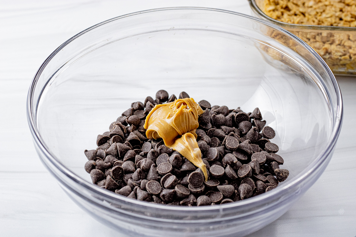 chocolate chips in a glass bowl with peanut butter