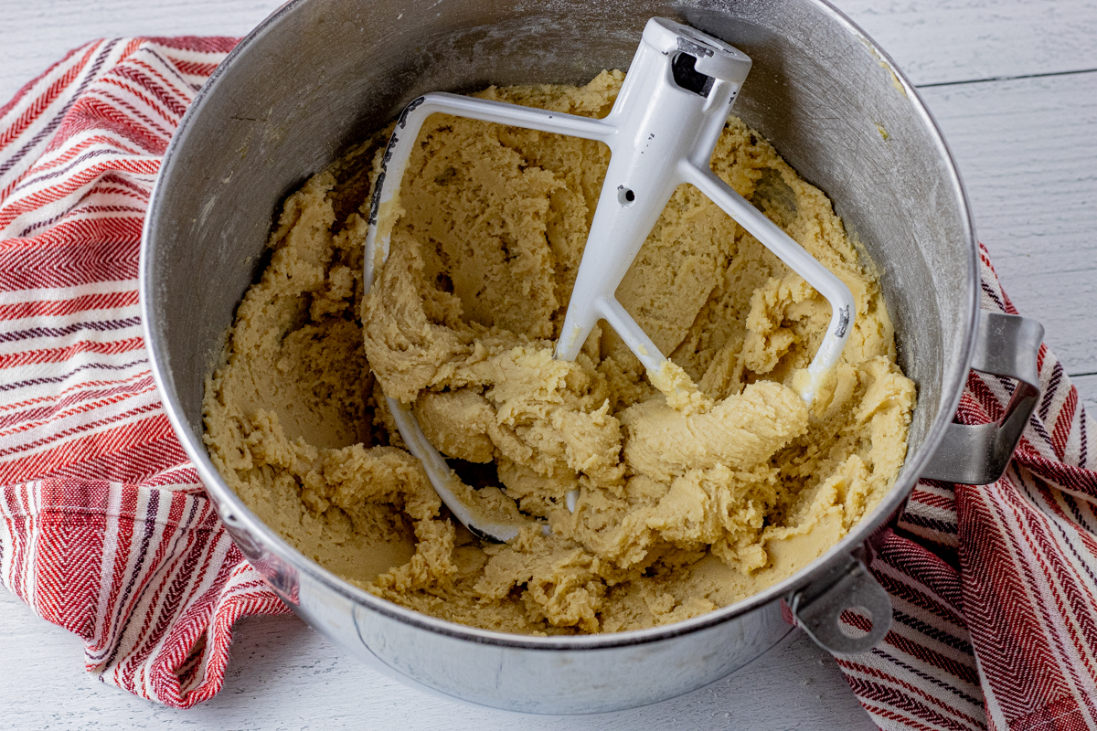 metal bowl of stand mixer filled with cookie dough