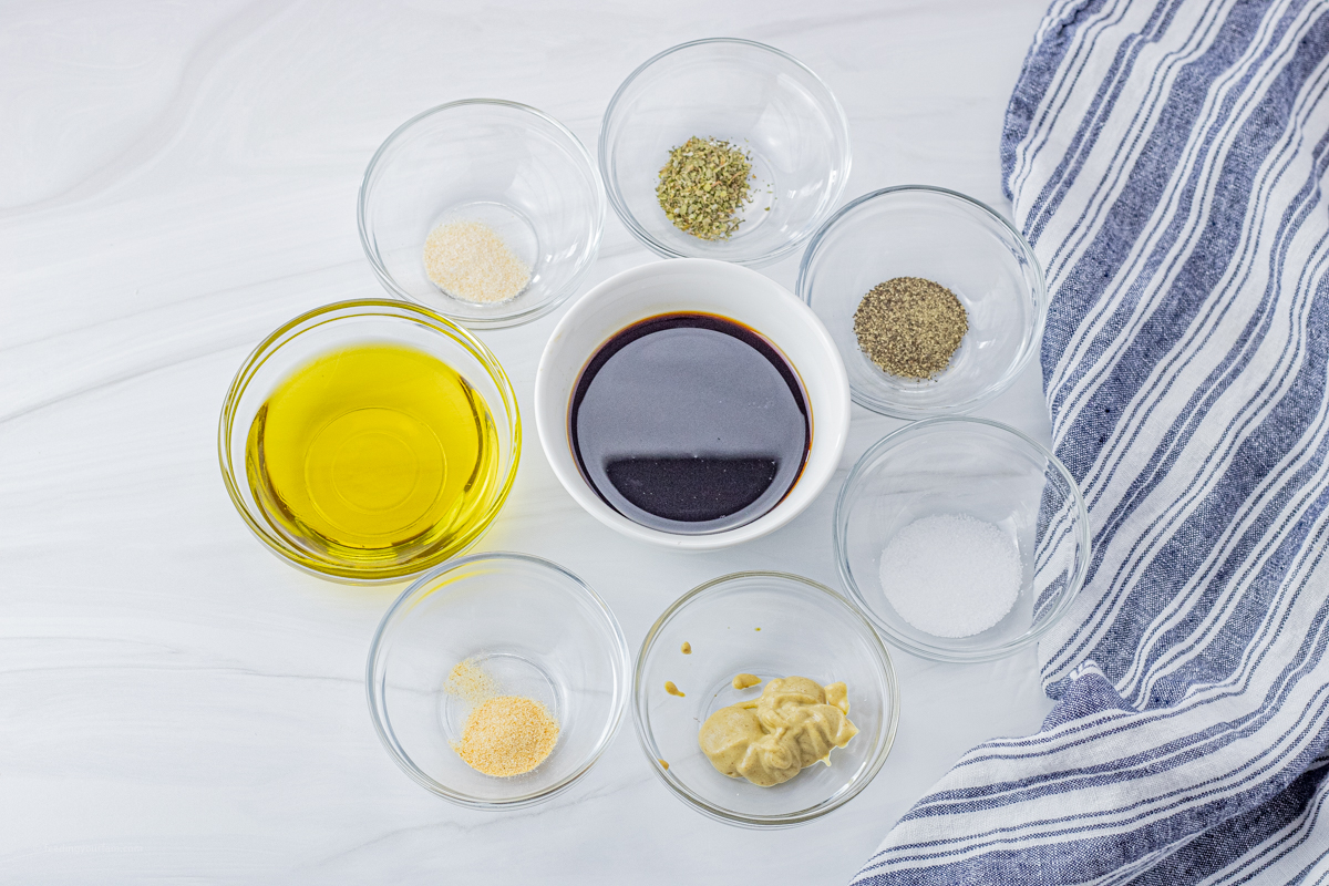 small glass bowls with ingredients to make a balsamic vinegar salad dressing