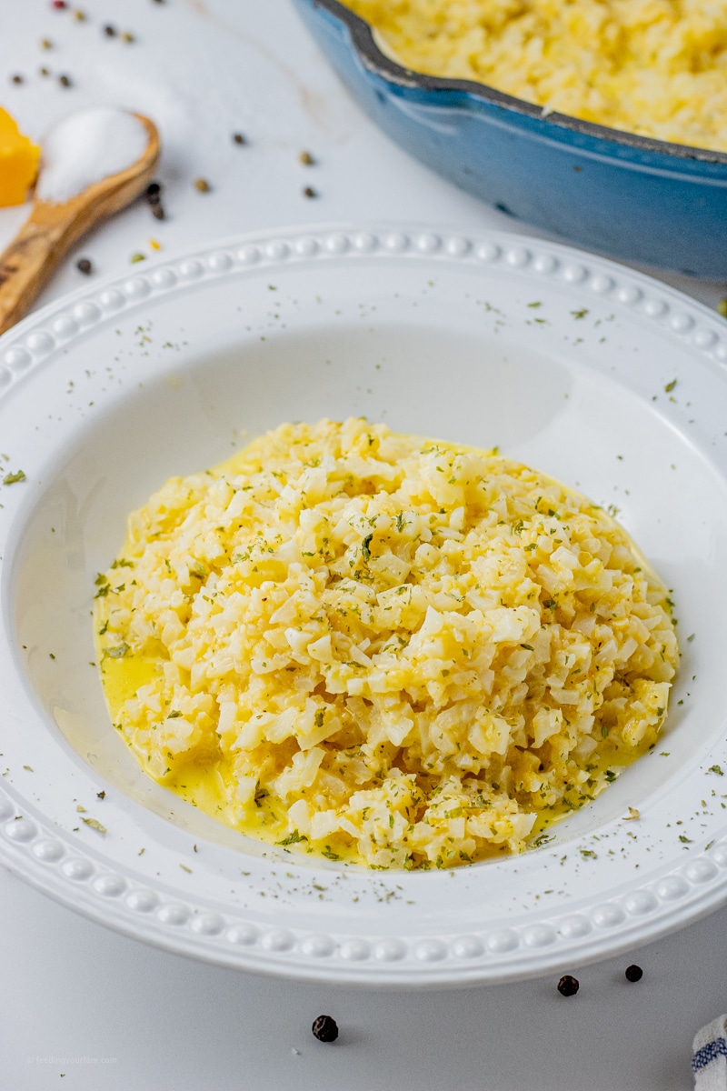 Cheesy Cauliflower Rice is a super simple, healthy and delicious vegetable side dish that pairs easily with anything. This cauliflower rice recipe is made in one pan with just a few simple ingredients, perfect for a quick weeknight meal.