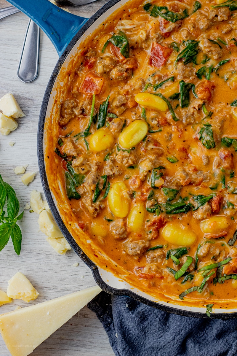 Creamy Gnocchi and Sausage is an easy dinner recipe for any night of the week. Made with a simple creamy tomato sauce, fluffy potato gnocchi and Italian sausage, the whole fam will love this recipe. The best part is it is all made in one pan for simple cleanup.