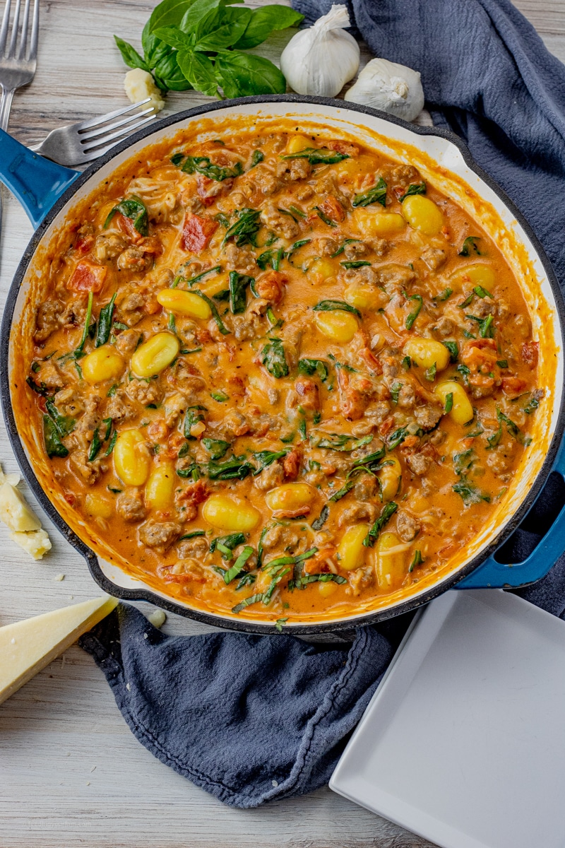 gnocchi pasta in a creamy tomato sauce with sausage and spinach