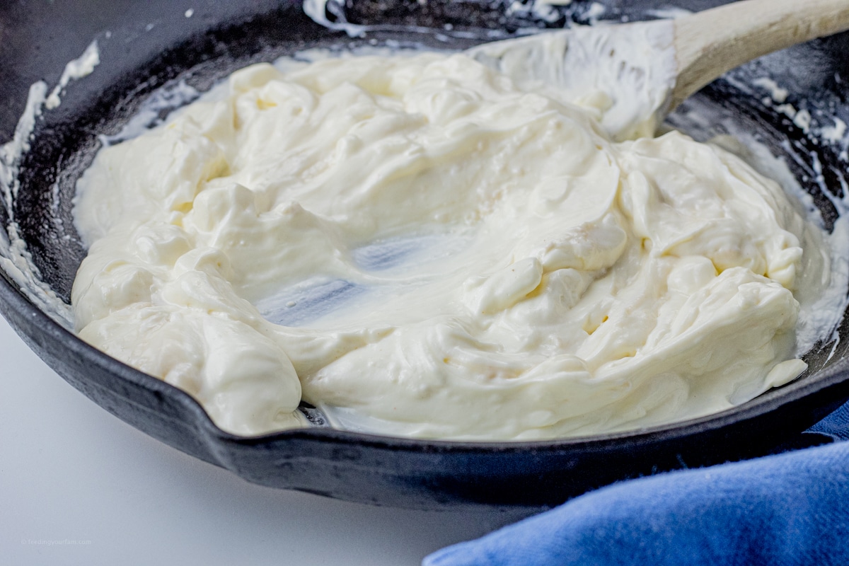 smooth sour cream in a cast iron pan