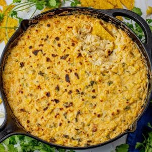 cast iron pan filled with a cheesy corn dip