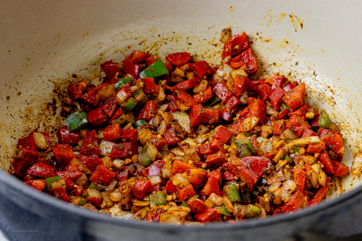 cooked onions, red peppers and jalapeno in a large pot