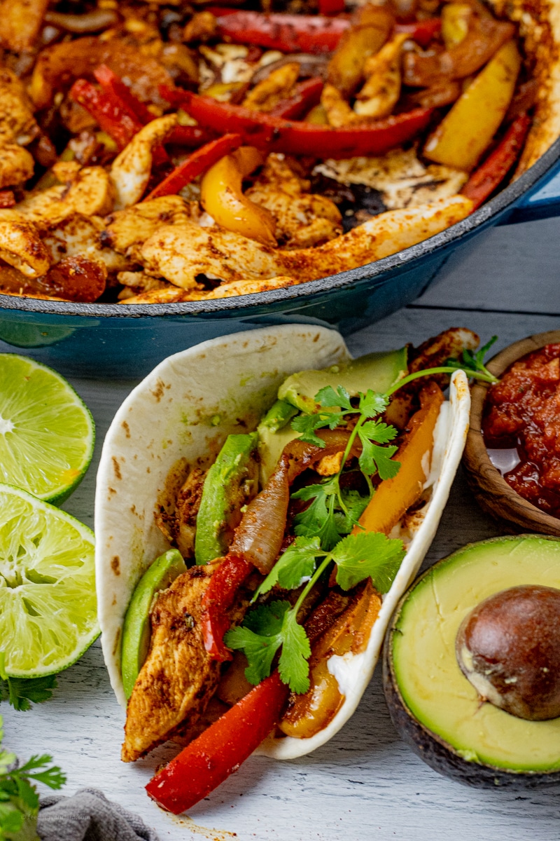 Chicken fajitas are loaded with chicken, peppers and onions in a simple seasoning, made in one pan and in under 30 minutes.