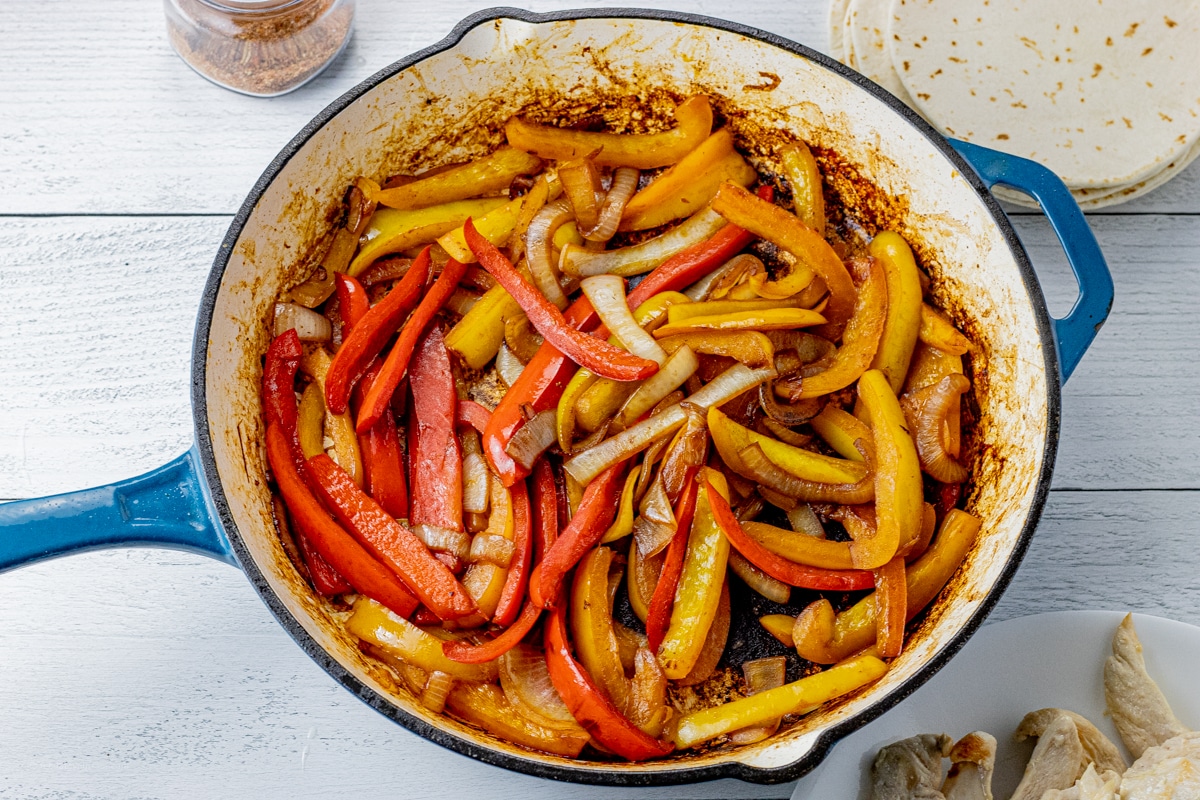cooked peppers and onions in a large skillet