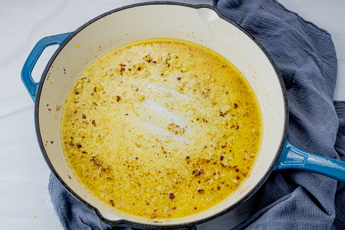 melted butter, lemon juice, garlic and spices in a cast iron pan