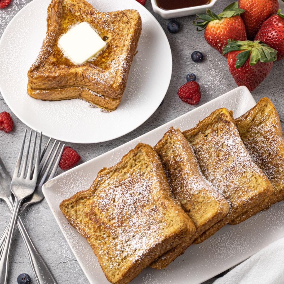 stack of cooked french toast on a white plate