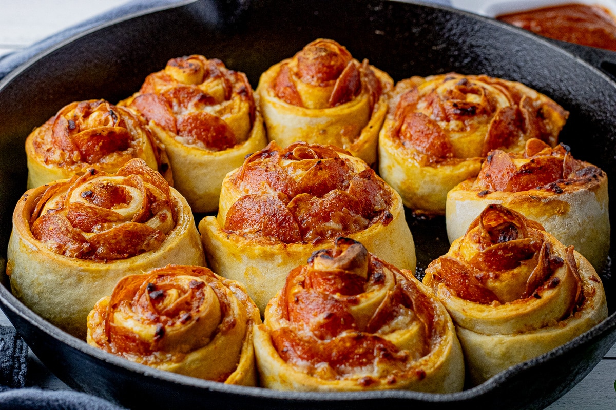 rolls made with pepperoni and mozzarella cheese in a cast iron pan